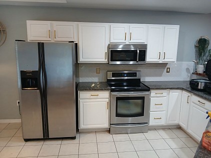The cabinets have been brought back to life with this fresh paint job