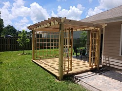 Custom-Built Wooden Pergola  A beautifully crafted wooden pergola, custom-built to add character, shade, and outdoor living space to the property. Built with quality materials and careful attention to detail, this pergola features sturdy wood construction, clean lines, and a timeless design that complements the surrounding home and landscape. A great example of custom craftsmanship by Triple Leaf LLC.