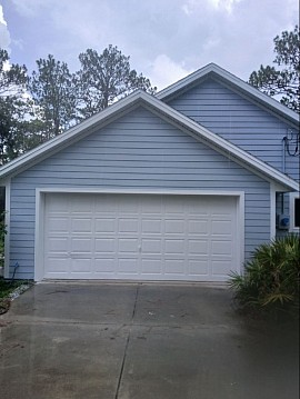 Freshly painted Gainesville, FL home featuring professional exterior house painting and a clean, beautiful finish by Triple Leaf LLC.
